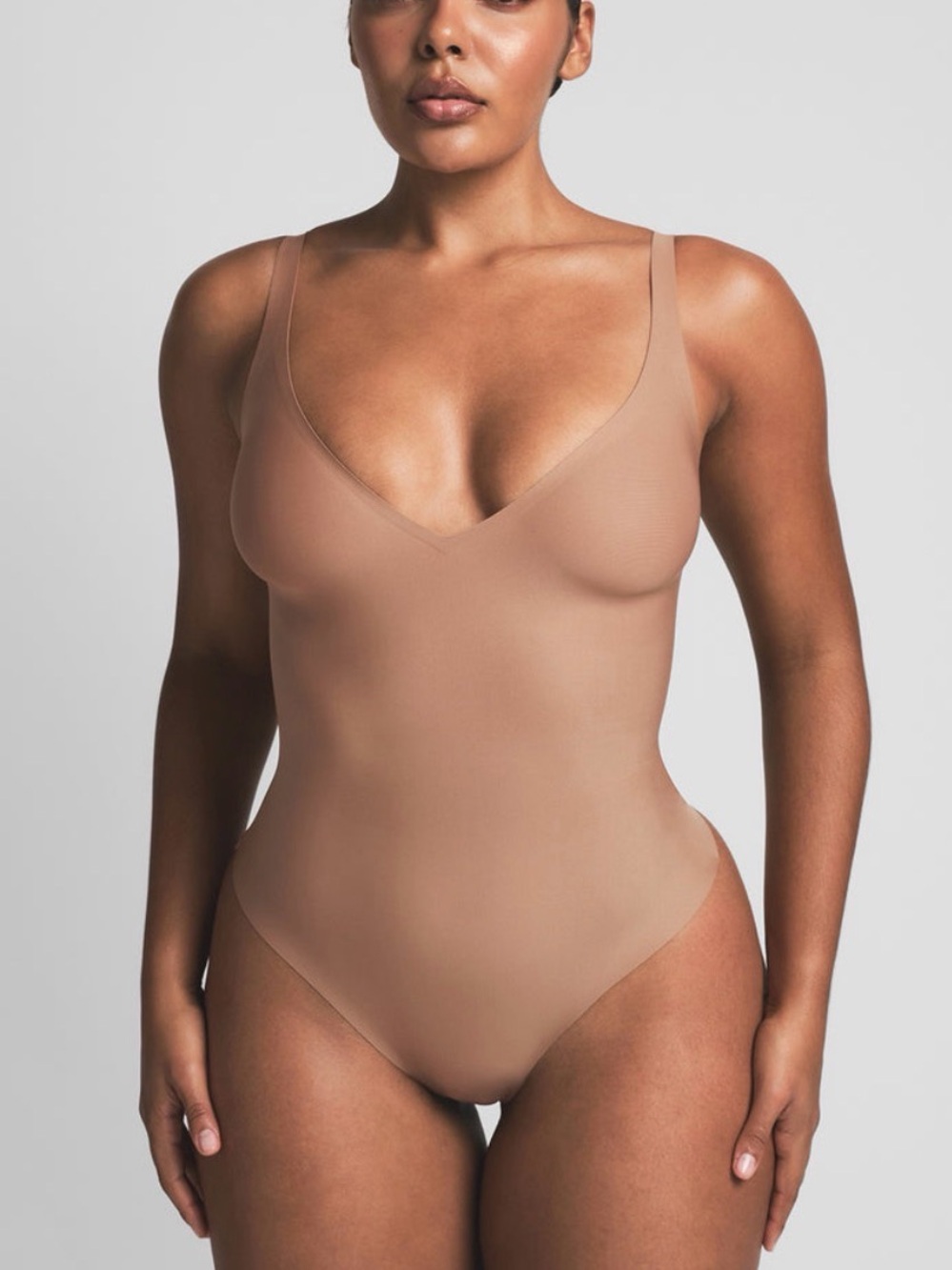 SKIMS Unlined Plunge Thong Bodysuit - Sienna